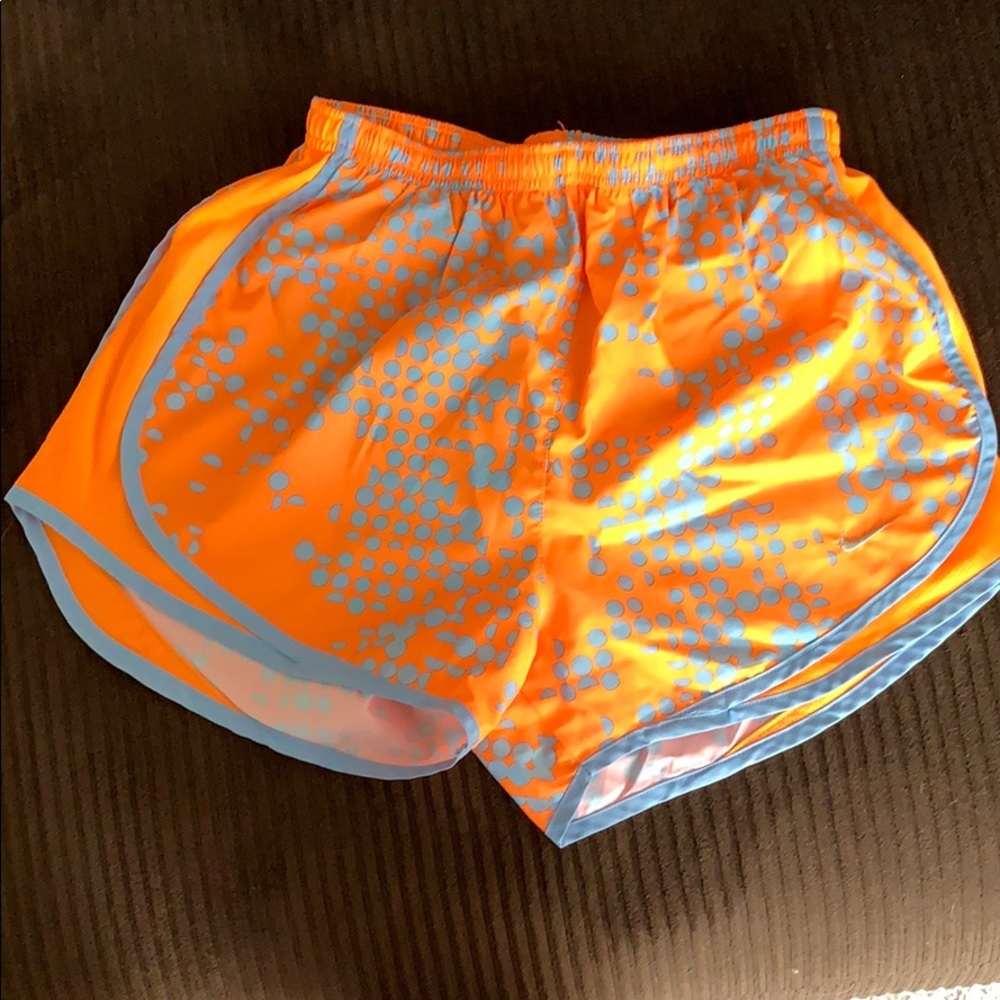 Nike running shorts. Small. Orange with blue dots.